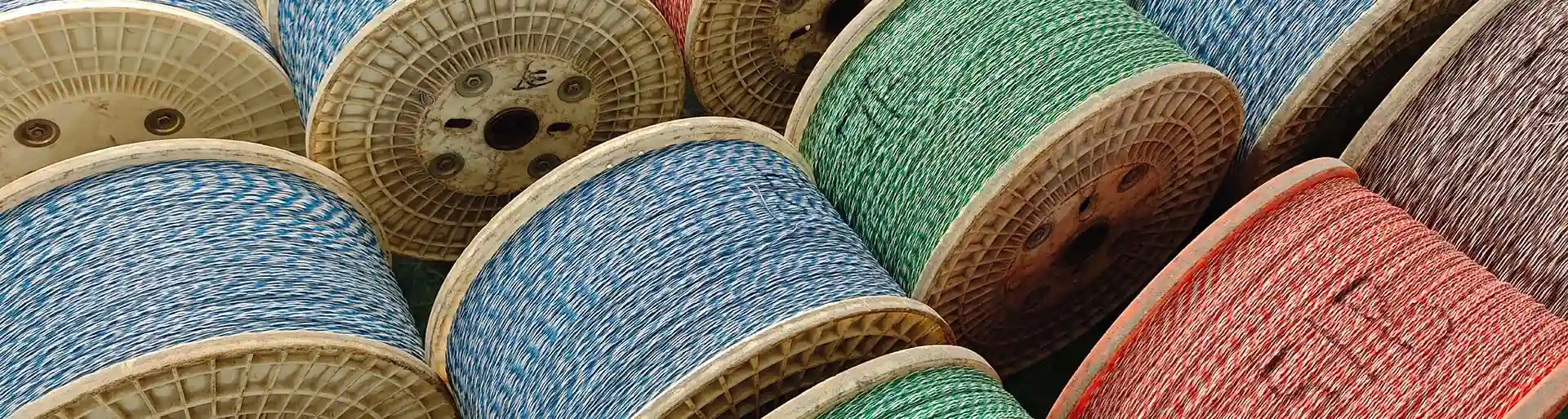 Cable spools wound with coloured conductors on the production floor