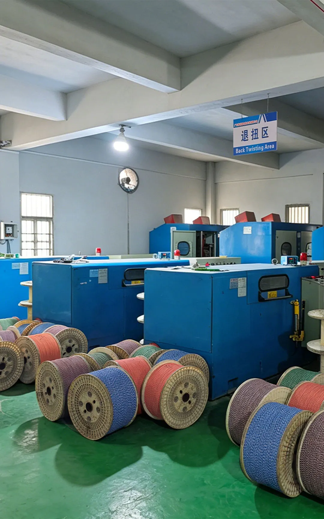 Cable production area with twisting machines and finished cable reels