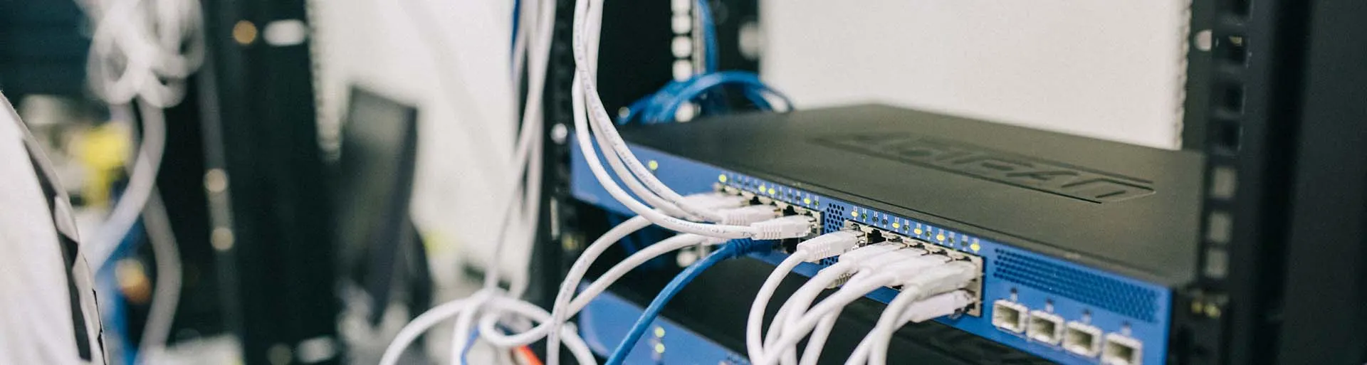 Indoor network cable patched into a rack-mounted switch in a server cabinet